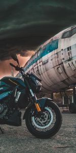 Clouds,Airplane,Mainly Cloudy,Overcast,Side View,Motorcycle,Motorcycles,Plane