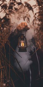 Grass,Miscellanea,Miscellaneous,Person,Hand,Human,Lantern,Lamp,Smoke