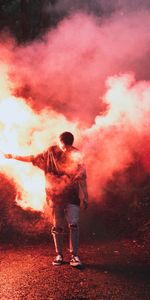 Miscellanea,Miscellaneous,Person,Coloured Smoke,Human,Night,Colored Smoke,Smoke,Rain