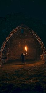 Night,Dark,Person,Structure,Human,Arch,Torch