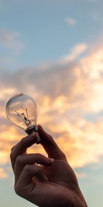 Sky,Clouds,Hand,Miscellanea,Miscellaneous,Light Bulb