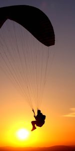 Sky,Silhouette,Person,Flight,Human,Paraglider,Sports,Paragliding