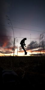 Silhouette,Rebondir,Sauter,Coucher De Soleil,Herbe,Humain,Personne,Sombre